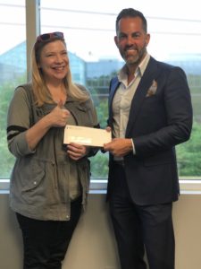 Nassau Personal injury lawyer Frank Bruno with a happy client and their settlement check